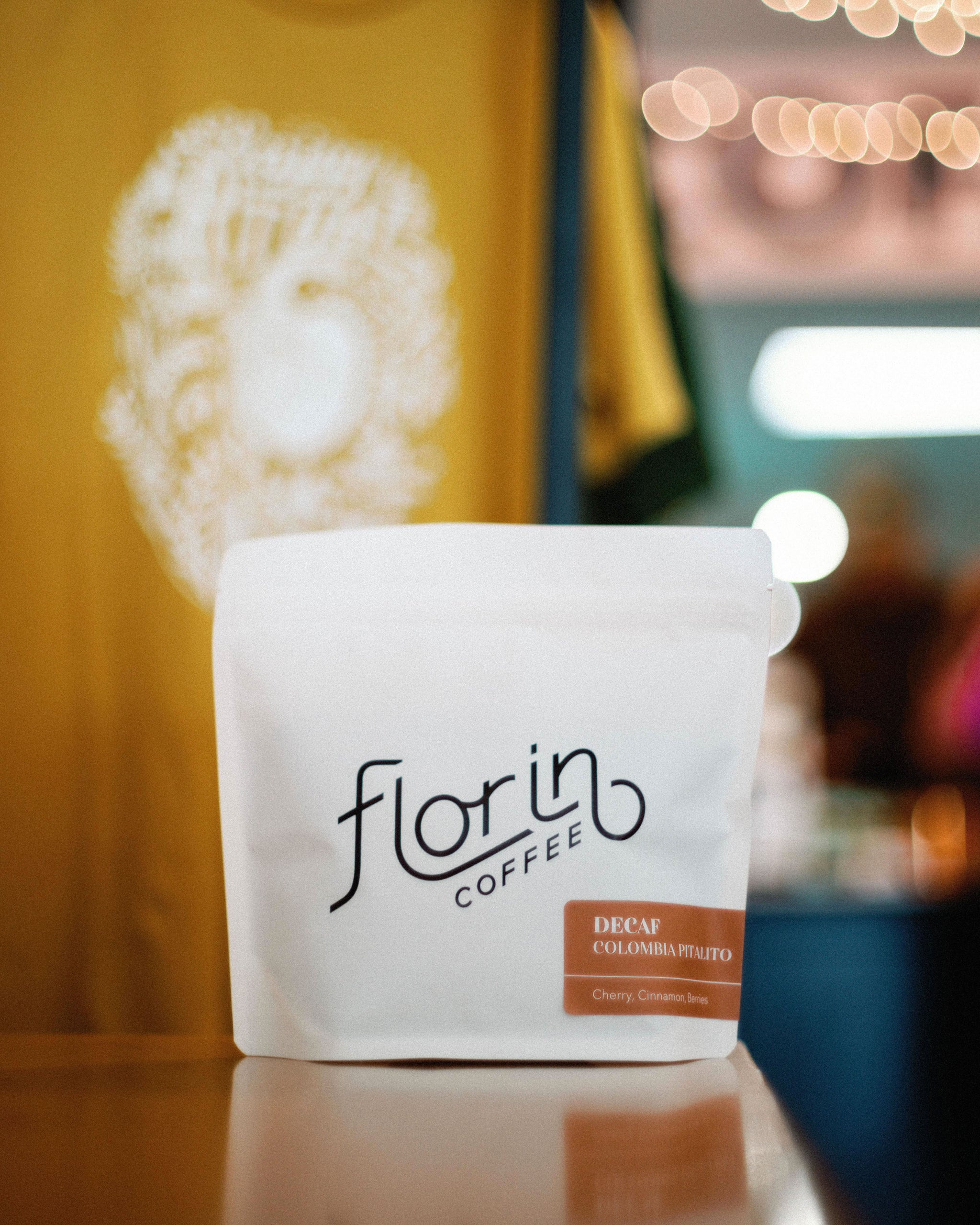 A white bag of coffee beans from Rosso Coffee Roasters